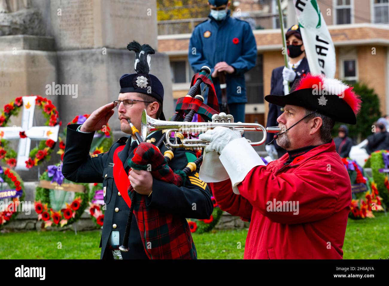Bugler plays The Last Post. Cambridge cenotaph  remembrance day ceremony 2021. Cambridge Ontario Canada. Stock Photo