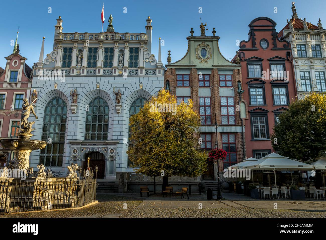 GDANSK, POLAND - Oct 08, 2021: The Neptune's Fountain in front of the entrance to the Artus Court in the old city of Gdansk, Poland Stock Photo