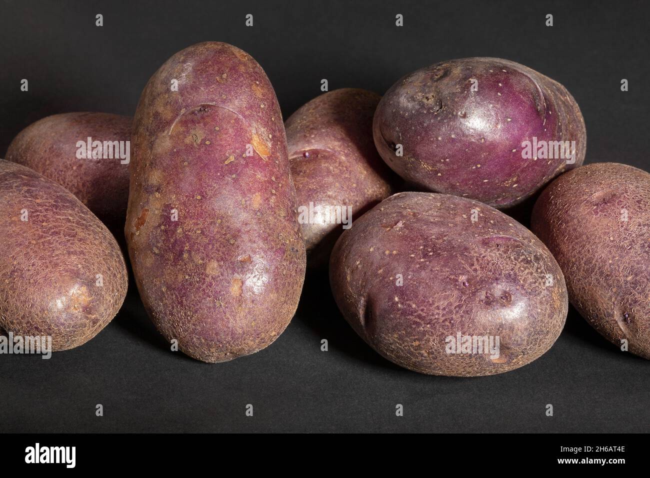 red potato on black background Stock Photo