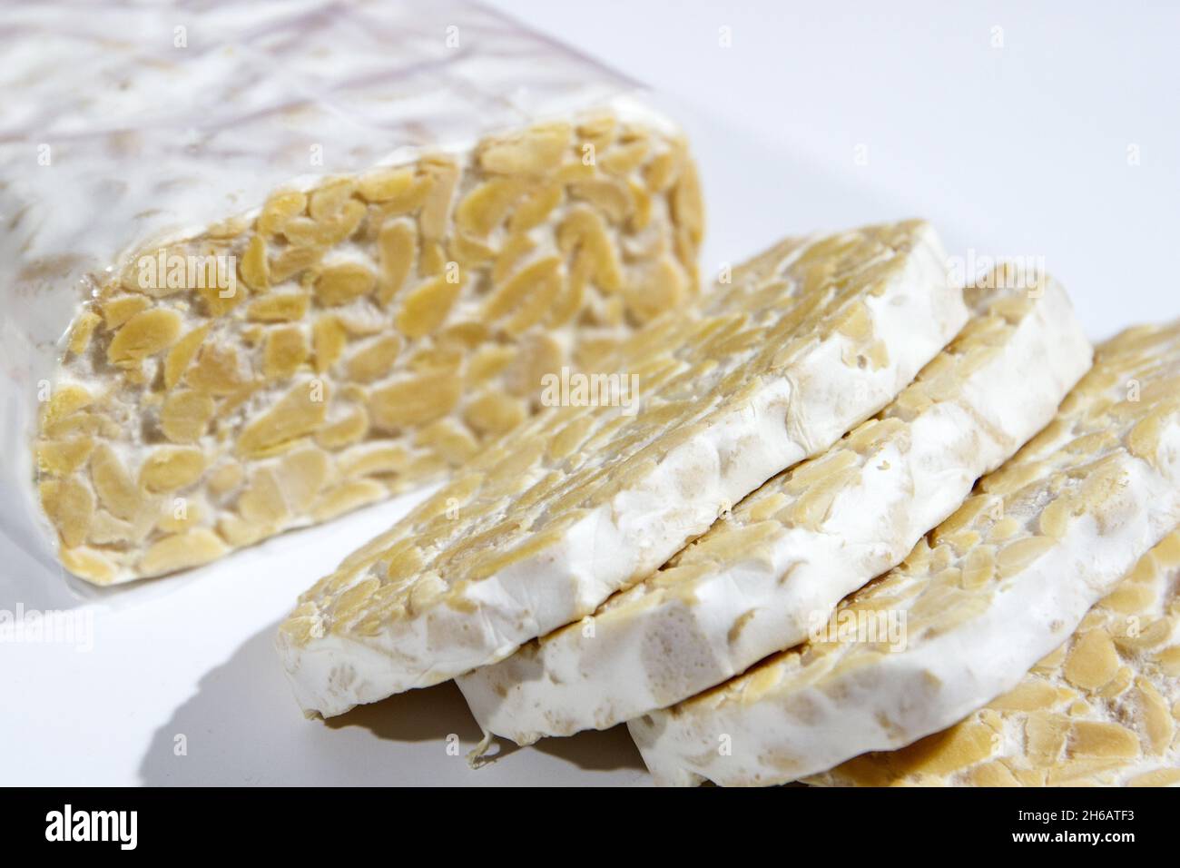 A close up of Tempeh or tempe slices isolated on white background Stock ...