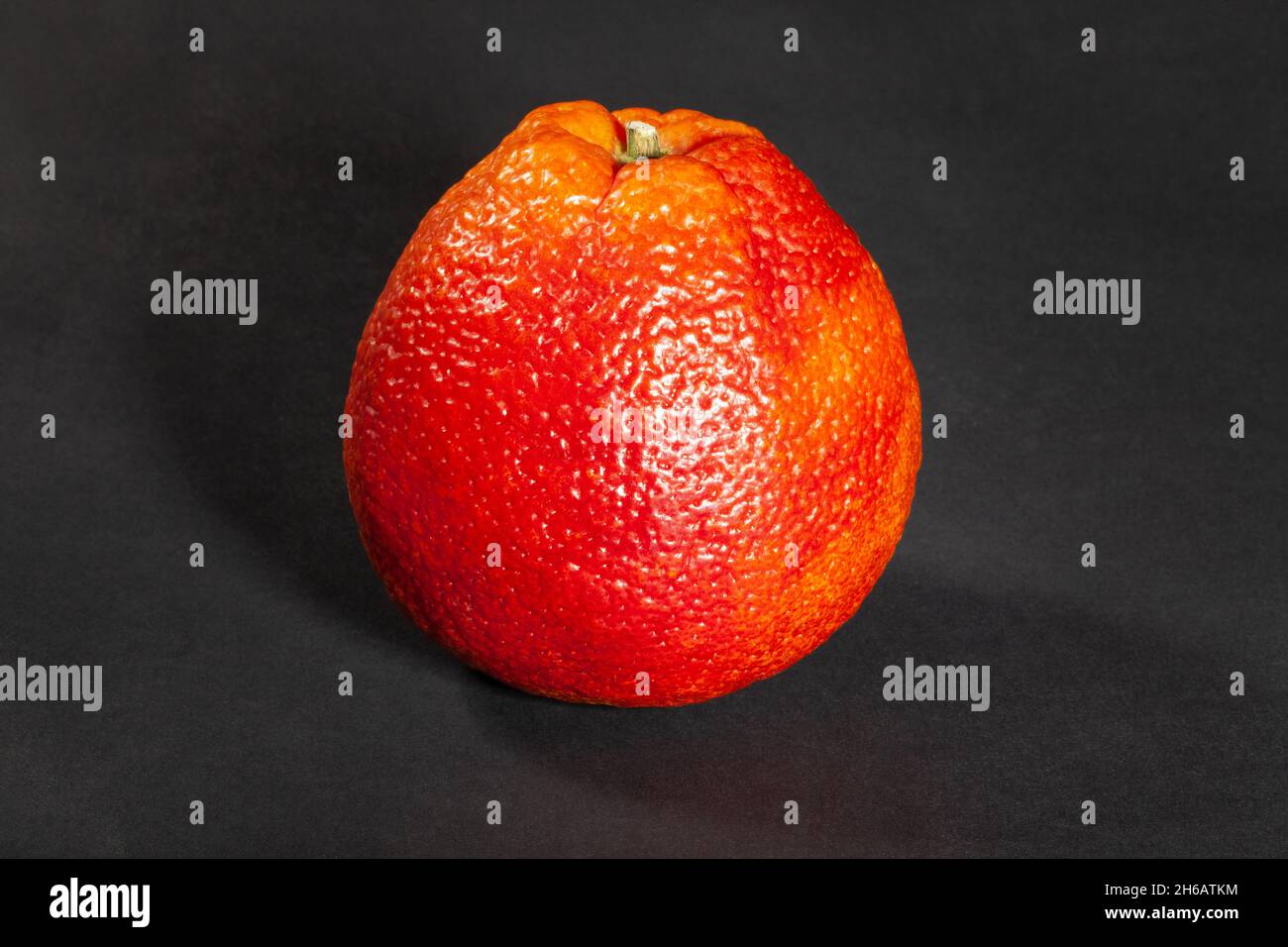 blood orange on black background Stock Photo