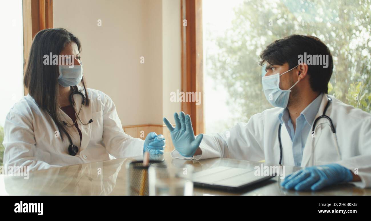 Two Doctors Conversation Two doctor colleagues having a discussion about a patient Stock Photo ...
