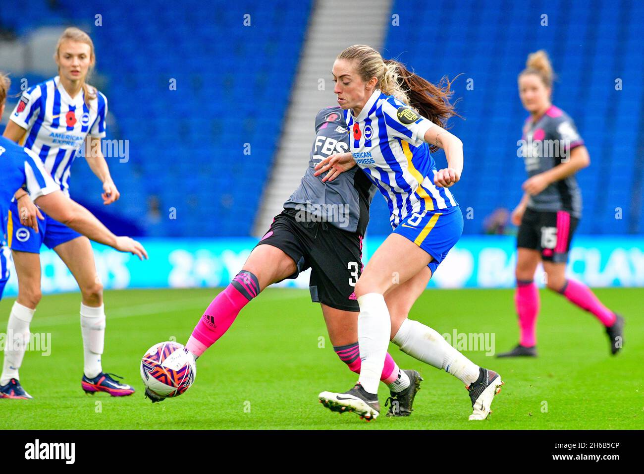 Brighton, UK. 14th Nov, 2021. Sam Tierney of leicester City and Megan Connolly of Brighton and Hove Albion battle for the ball during the FA Women's Super League match between Brighton & Hove Albion Women and Leicester City Women at The Amex on November 14th 2021 in Brighton, England. (Photo by Jeff Mood/phcimages.com) Credit: PHC Images/Alamy Live News Stock Photo
