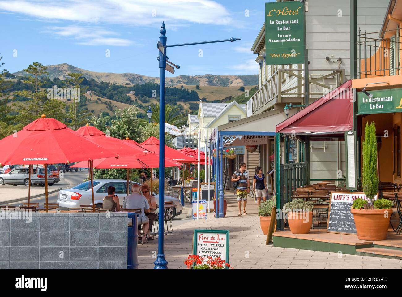 Waterfront shops and restaurants, Beach Road, Akaroa, Banks Peninsula, Canterbury, New Zealand Stock Photo