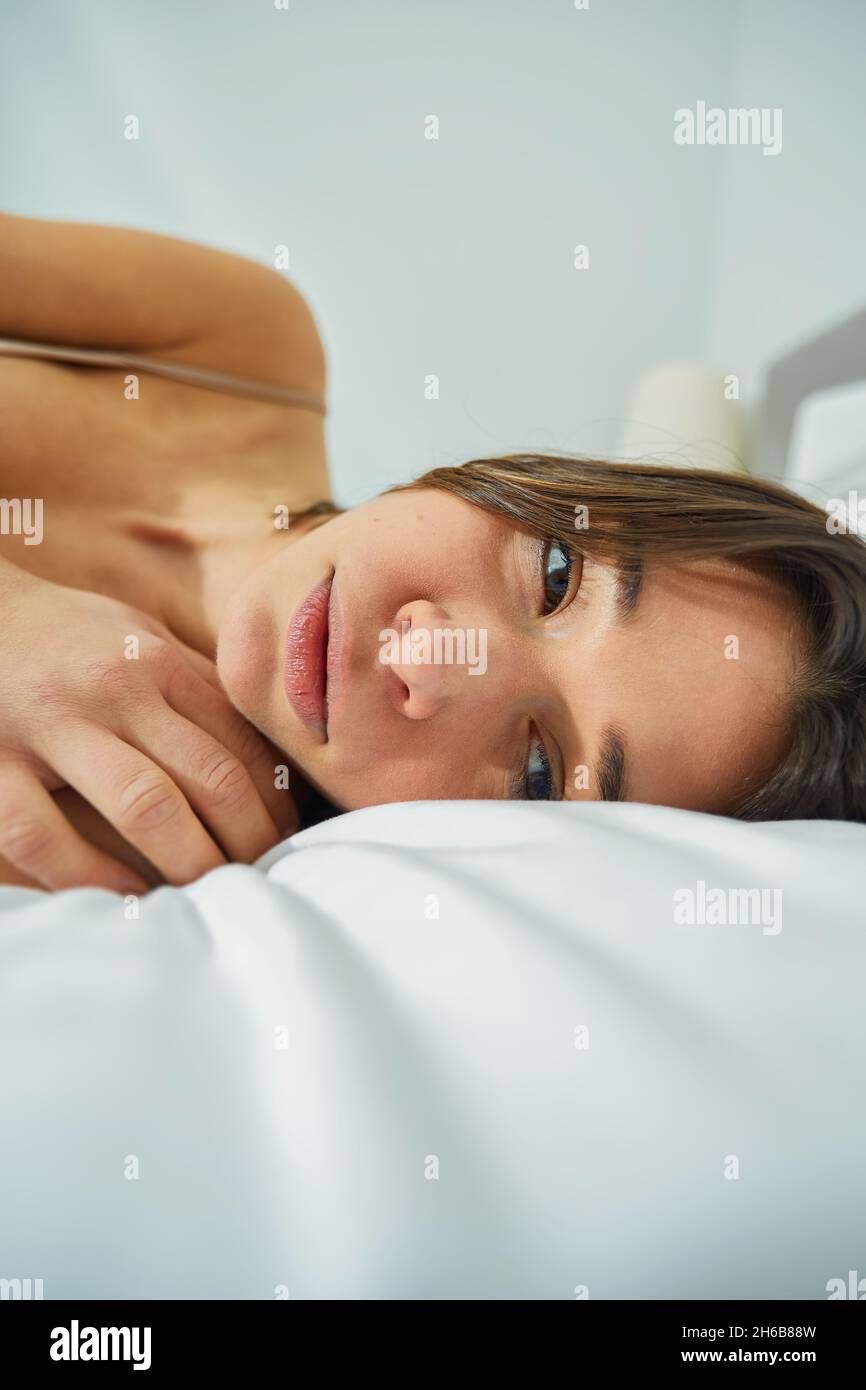 Sad woman with depression alone in bed and struggle with problem and loneliness. Stock Photo