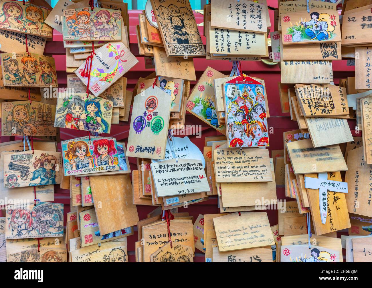 tokyo, japan - september 17 2019: Shinto timber votive plaques called Ema illustrated by worshippers with illustrations of tv anime characters in the Stock Photo