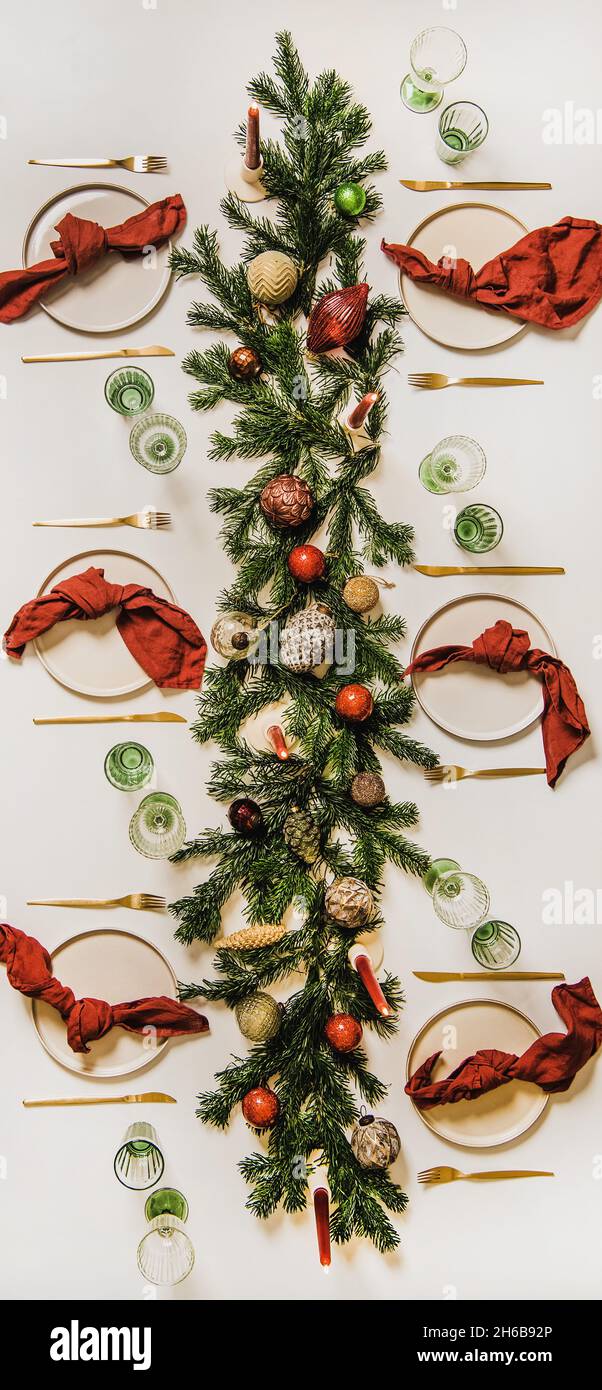 Flat-lay of festive Christmas table setting with decorations, vertical composition Stock Photo