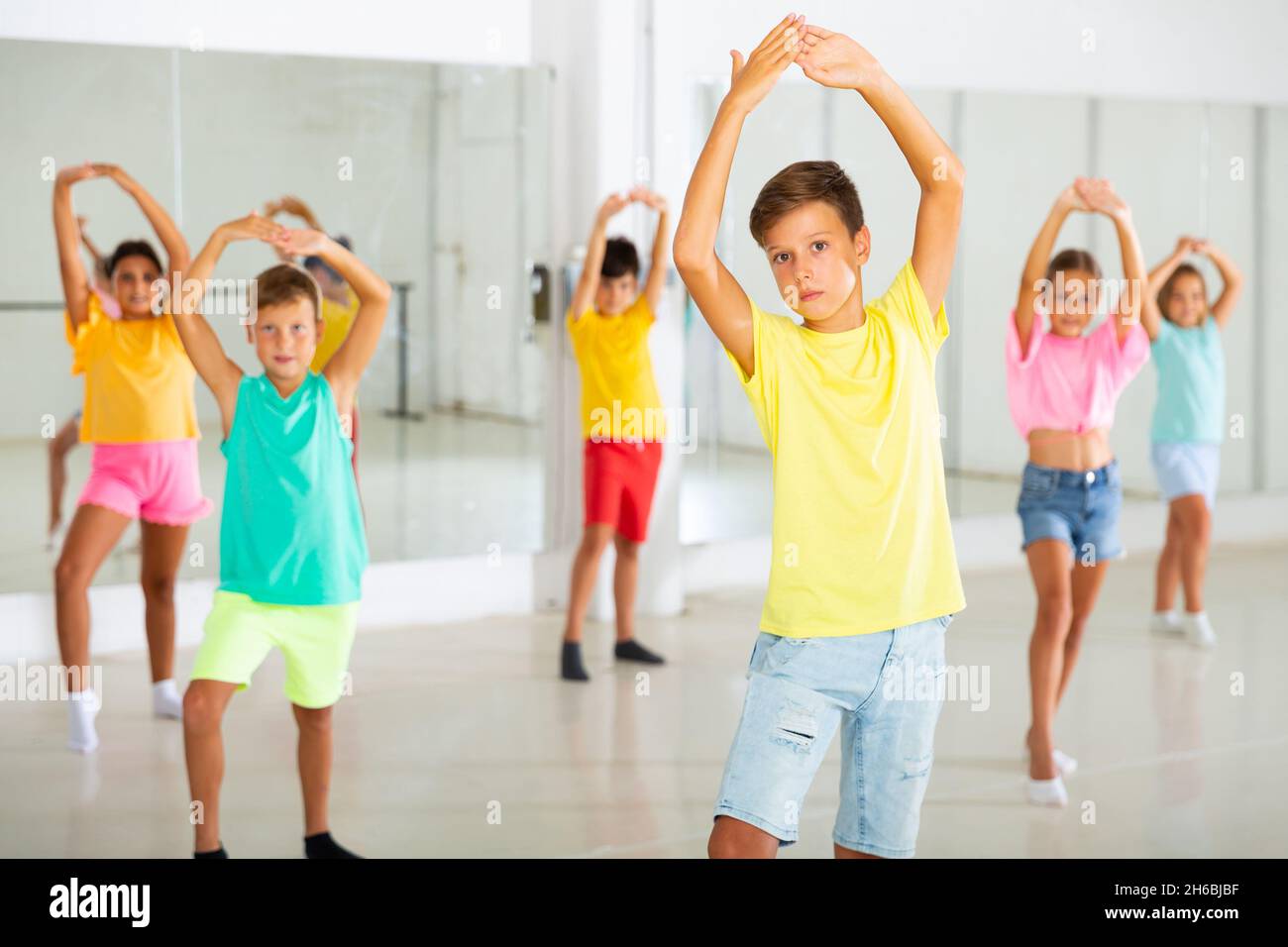 Group Of Fashionable Children Learning A Modern Dance While Having 