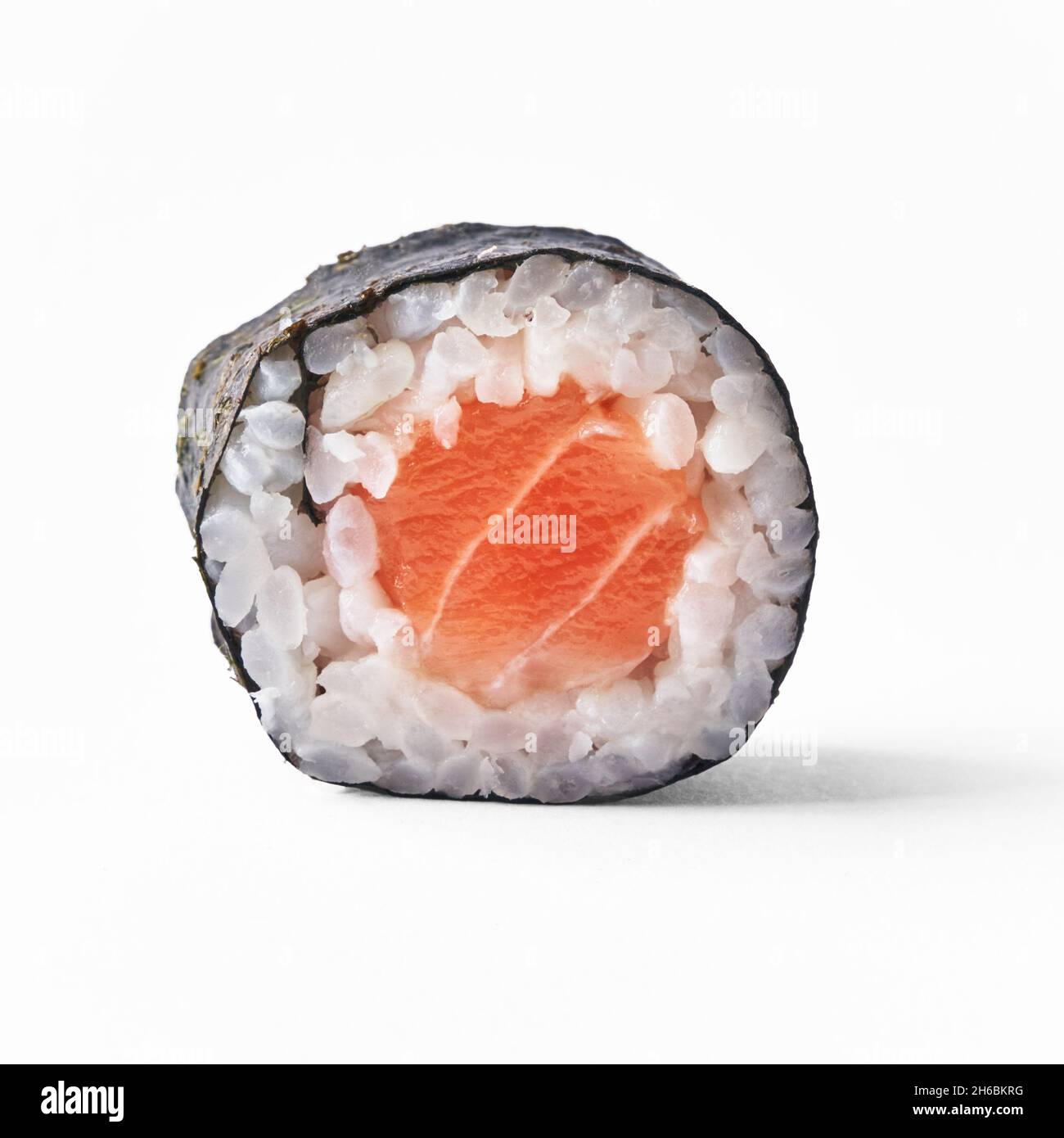 Single salmon sushi maki isolated on white background Stock Photo - Alamy