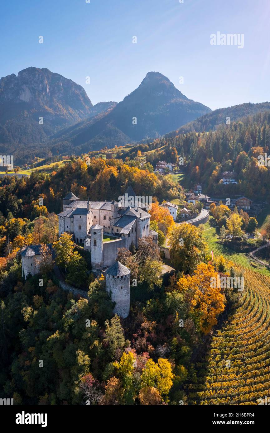 Aerial view of the Prösels Castle (Presule) in autumn. Fie allo Sciliar, Bolzano district, South Tyrol, Dolmites, Trentino Alto Adige, Italy, Europe. Stock Photo