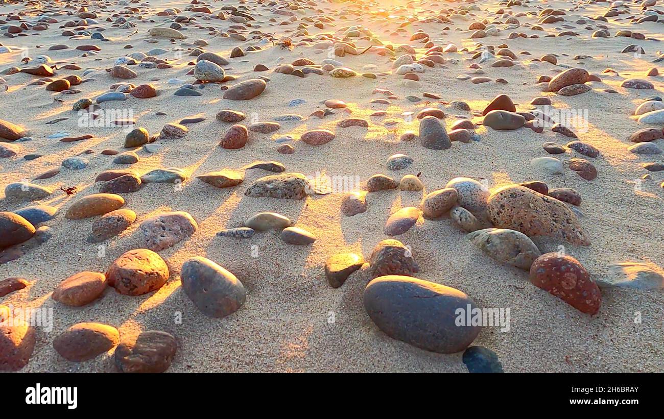 Photo of the sun on pebbles Stock Photo