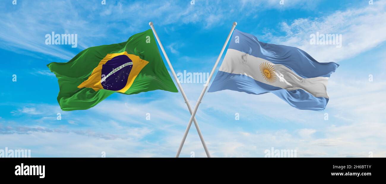 crossed national flags of Brazil and Argentina flag waving in the wind ...