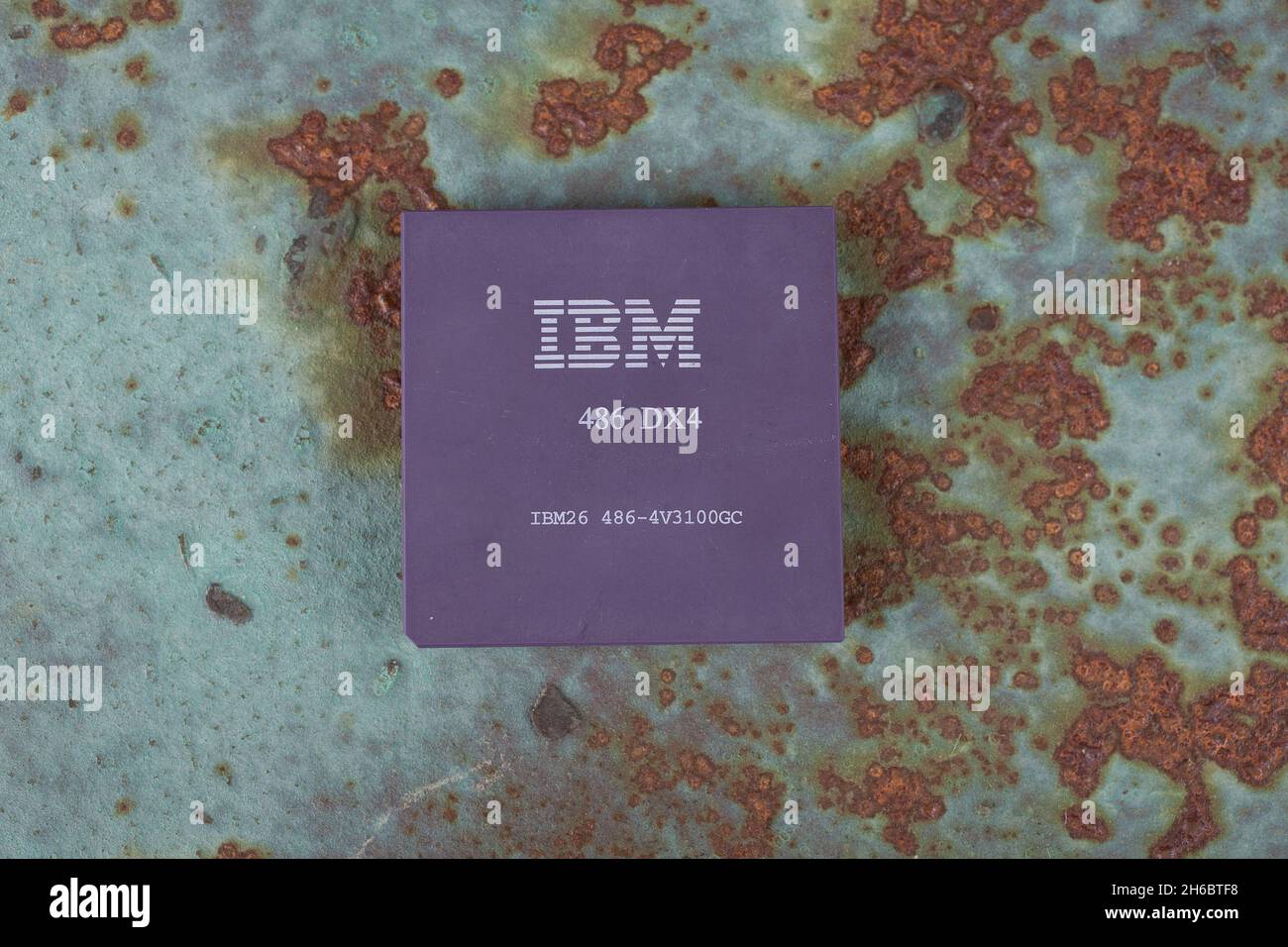 KYIV, UKRAINE - April 22, 2020. IBM 486DX4 processor on rusty metal background. Stock Photo