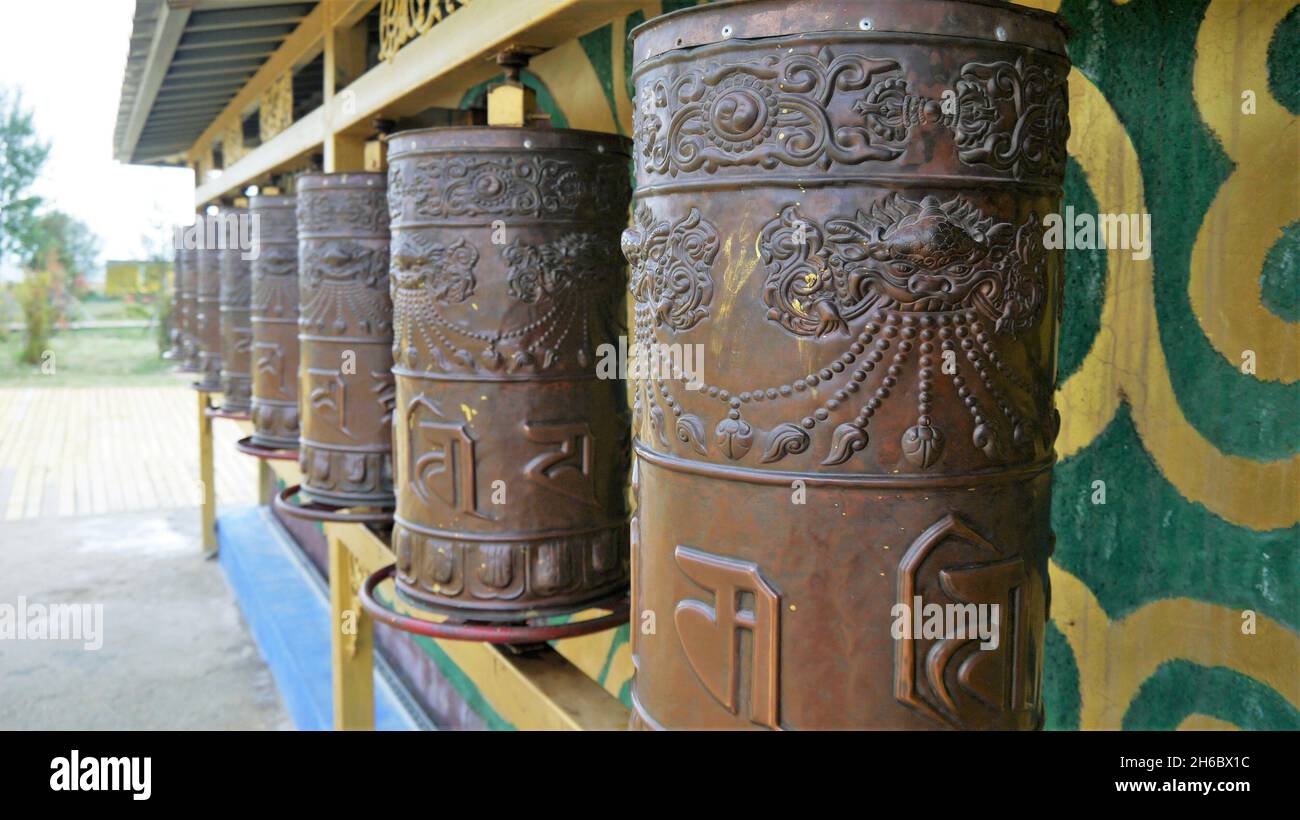 Wooden prayer drums hi-res stock photography and images - Alamy