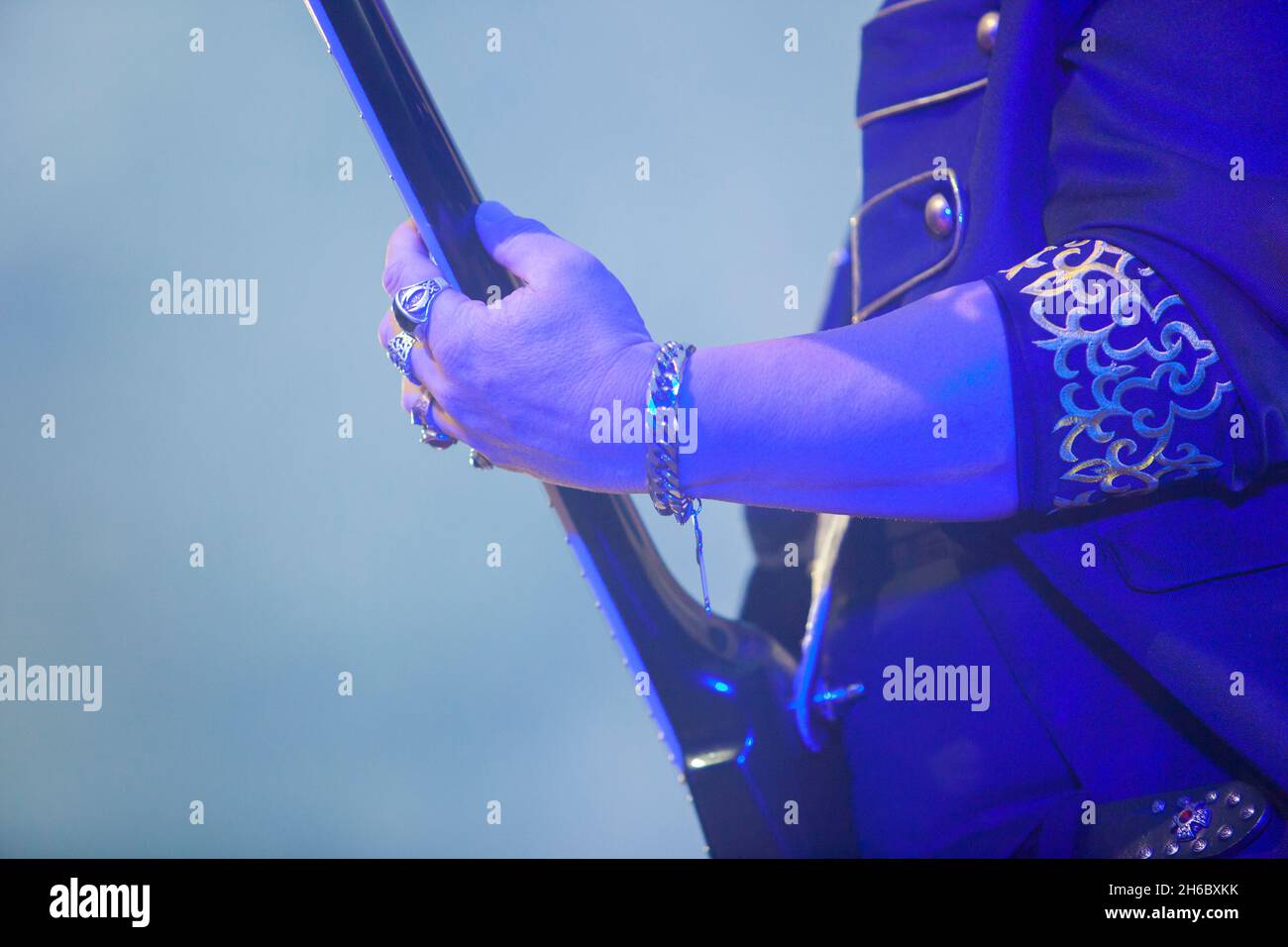 Hard rock musicians performing. Guitar neck Stock Photo