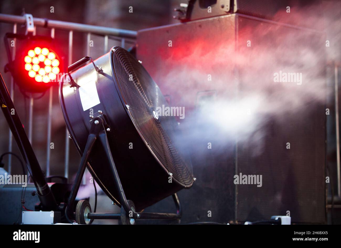 Stage blower used with haze machine during live rock performance. Selective focus Stock Photo