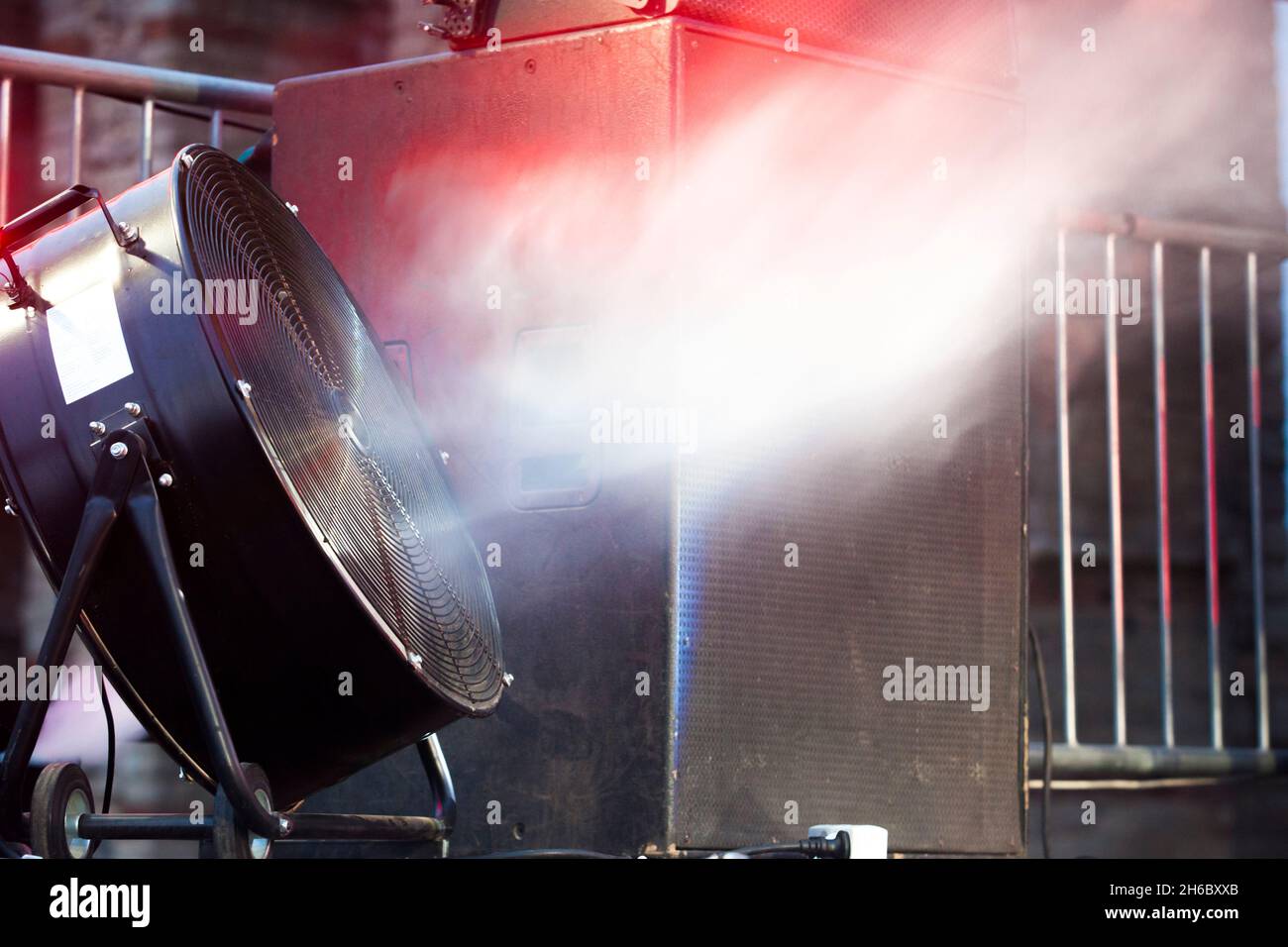 Stage blower used with haze machine during live rock performance. Selective focus Stock Photo