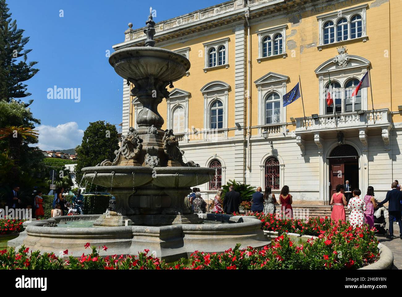 Wedding guests waiting the arrival of the bride and groom in front of