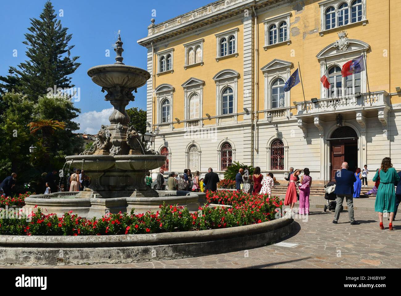 Wedding guests waiting the arrival of the bride and groom in front of