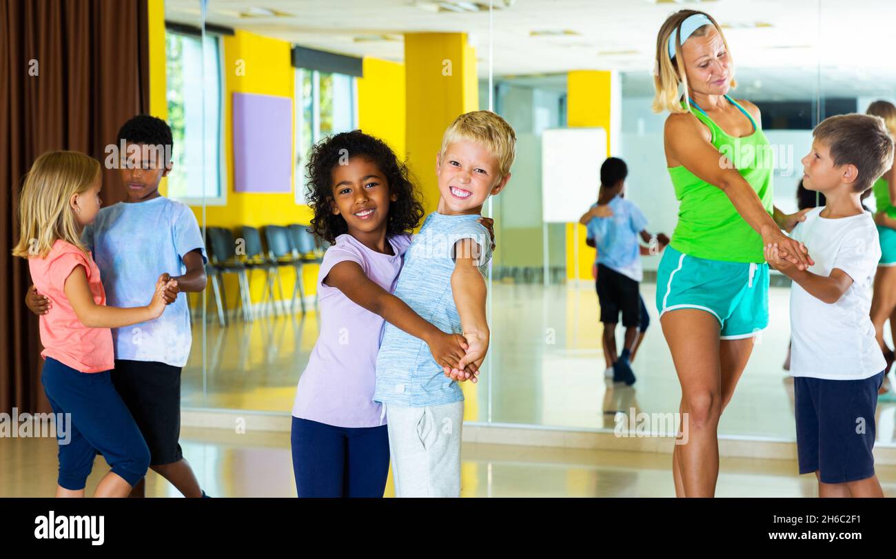 Tweens in pairs learning to dance waltz Stock Photo Alamy