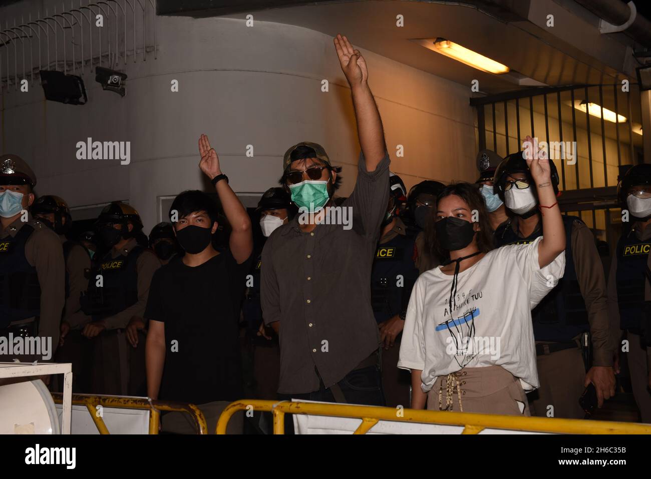 Bangkok, Thailand. 14th Nov, 2021. Representatives of the anti-absolute monarchy group raised three fingers after meeting with German Ambassador to Thailand Inside the Embassy of Germany Thailand, South Sathorn Road, among the riot police stationed in front on November 14, 2021. (Credit Image: © Teera Noisakran/Pacific Press via ZUMA Press Wire) Stock Photo