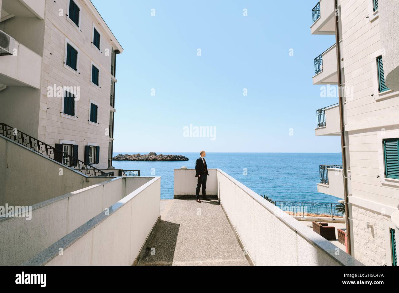 Man standing between two trees hi-res stock photography and images - Alamy
