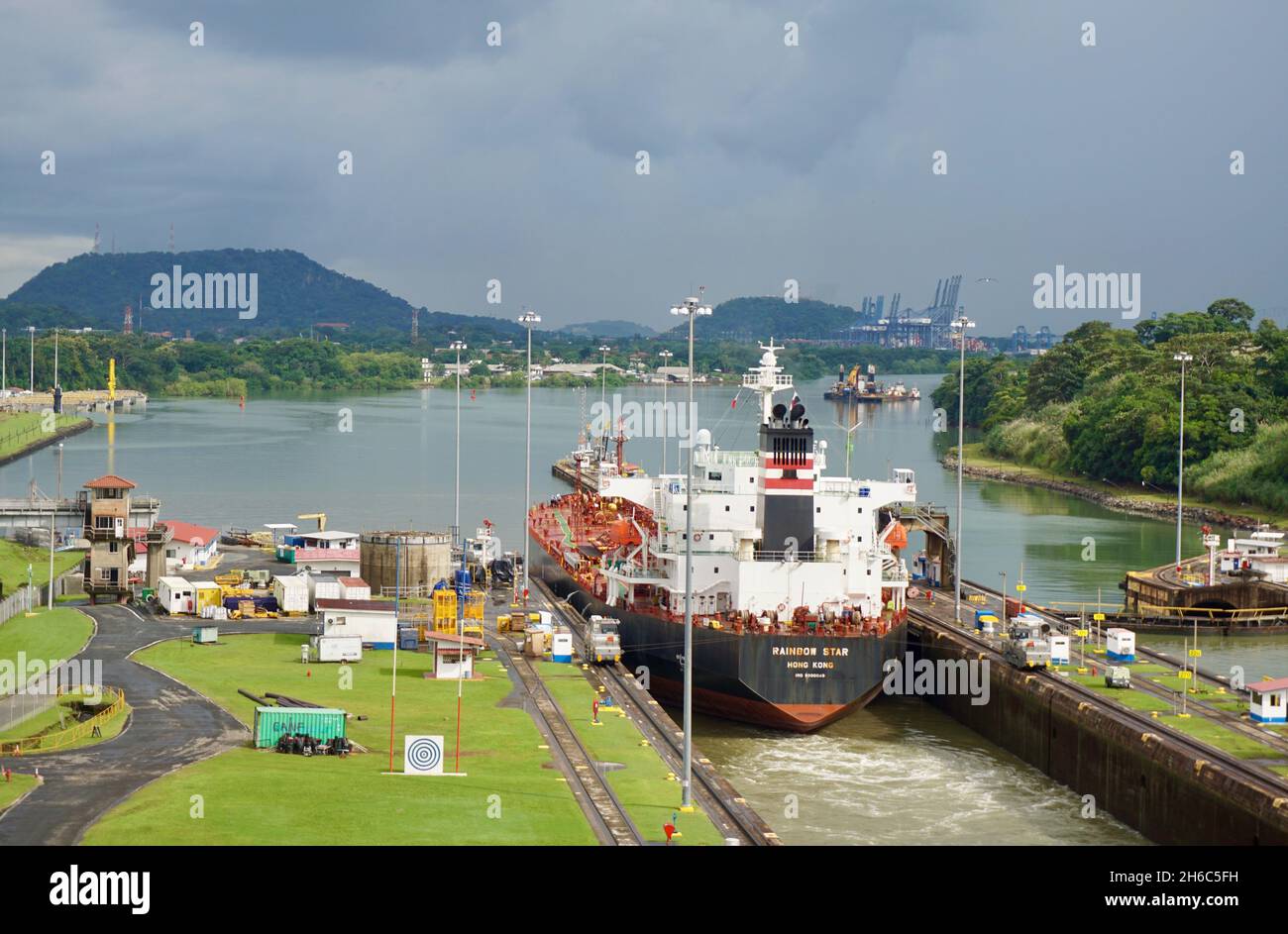 A cargo ship traverses the old locks on the Panama Canal Stock Photo