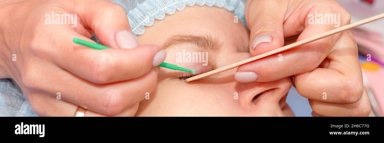 Professional skin and eye care. Extension procedure, eyelash removal in a beauty salon. Beautiful with professional skin for healthcare design. Eye ca Stock Photo