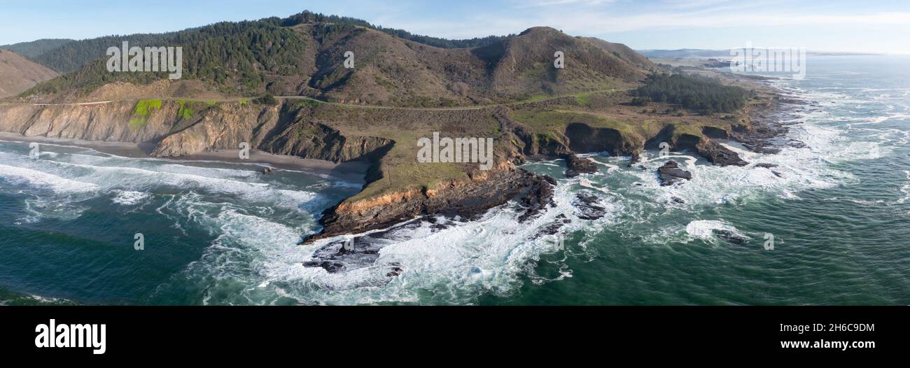 The serene Pacific Ocean washes onto the rugged coastline of Northern California, not far north of Fort Bragg in Mendocino County. Stock Photo