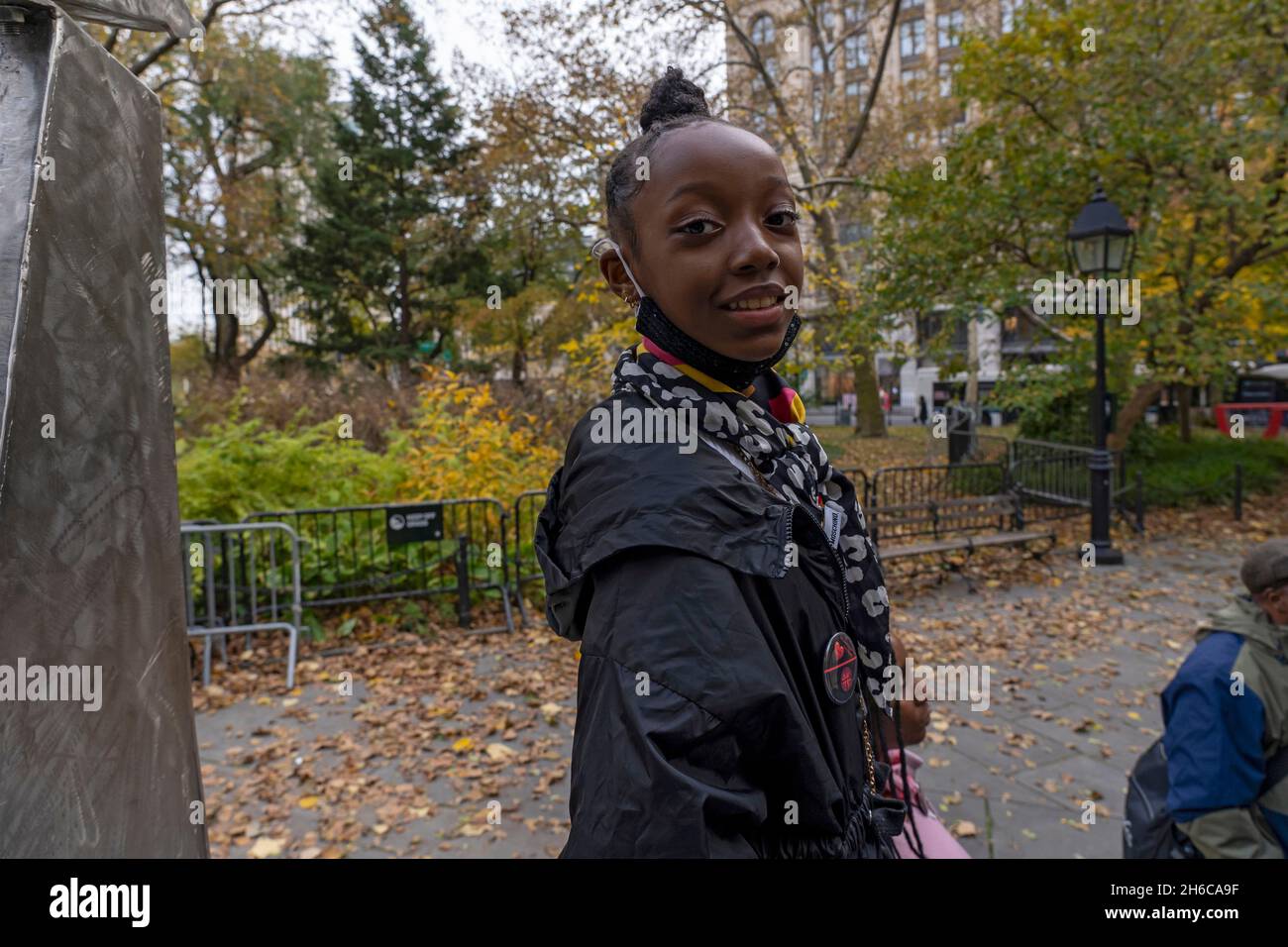 NEW YORK, NY - NOVEMBER 14: Serenity, age 10, attends a rally at City Hall Park on November 14, 2021 in New York City.   Activists against gun violence staged a rally in support of mayor-elect Eric Adams, who was threatened by New York BLM co-founder Hawk Newsome who vowed there'll be 'riots,' 'fire' and 'bloodshed' if mayor-elect Eric Adams follows through with his promise to bring back plainclothes anti-crime cops to battle New York's surge in violent crimes.   A coalition of Black and Brown community activists show solidarity with the mayor-elect Eric Adams and his plan to fight gun violenc Stock Photo