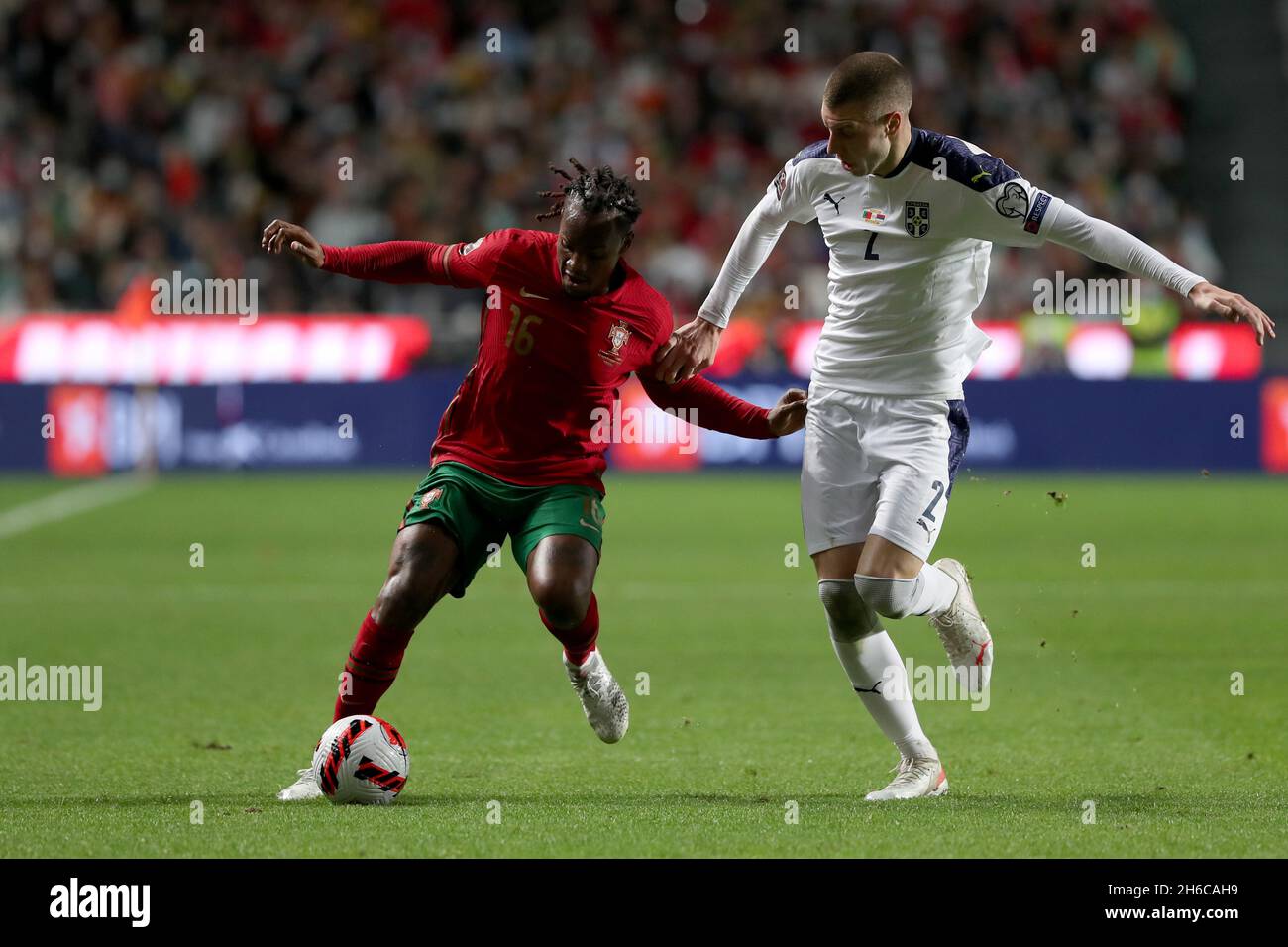 Lisbon, Portugal. 14th Nov, 2021. Portugal's midfielder Renato Sanches (L) vies with Serbia's defender Strahinja Pavlovic during the FIFA World Cup Qatar 2022 qualification group A football match between Portugal and Serbia at the Luz stadium in Lisbon, Portugal, on November 14, 2021. (Credit Image: © Pedro Fiuza/ZUMA Press Wire) Stock Photo
