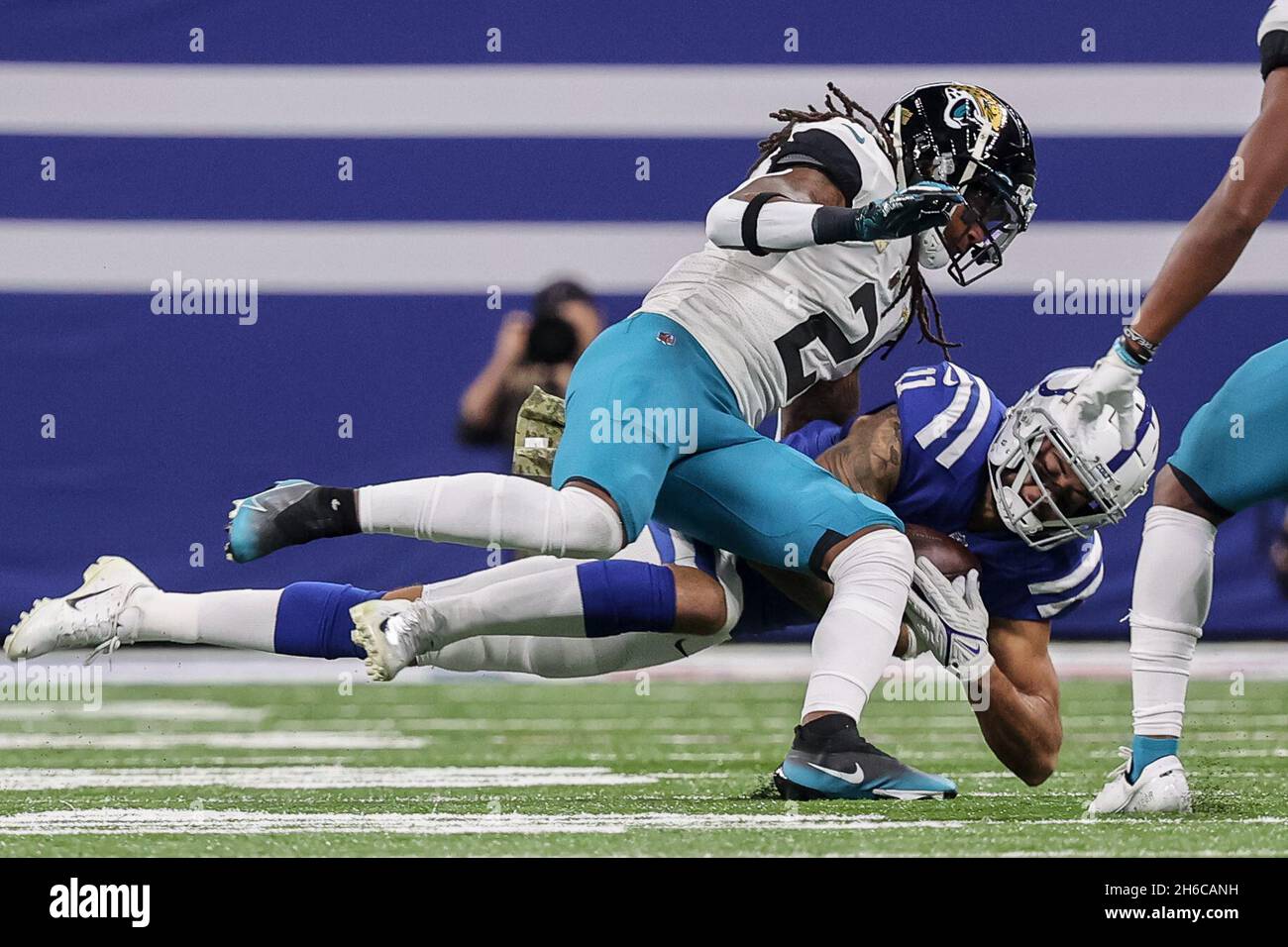 Indianapolis, Indiana, USA. 14th Nov, 2021. Indianapolis Colts tight end  Kylen Granson (83) is tackled along the sideline by Jacksonville Jaguars  free safety Rayshawn Jenkins (2) during the game between the Jacksonville