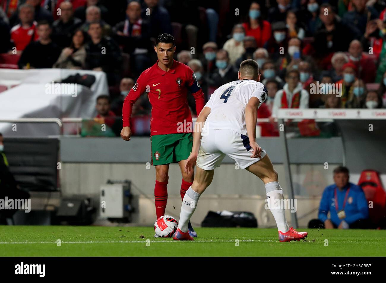 Lisbon, Portugal. 14th Nov, 2021. Portugal's forward Cristiano Ronaldo (L) vies with Serbia's defender Nikola Milenkovic during the FIFA World Cup Qatar 2022 qualification group A football match between Portugal and Serbia at the Luz stadium in Lisbon, Portugal, on November 14, 2021. (Credit Image: © Pedro Fiuza/ZUMA Press Wire) Stock Photo