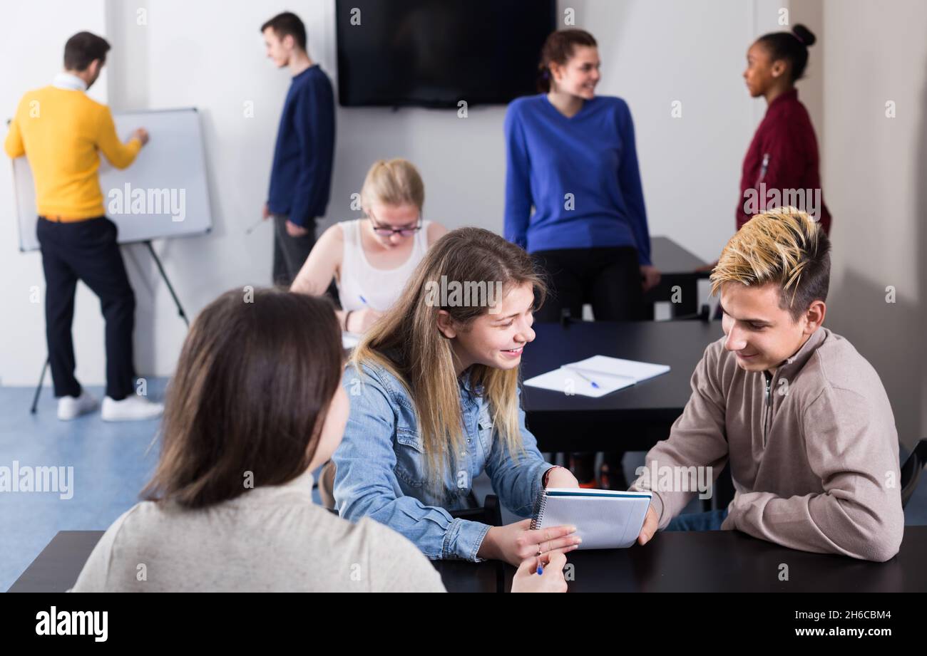 teens classmates having animated talks at break between classes Stock ...