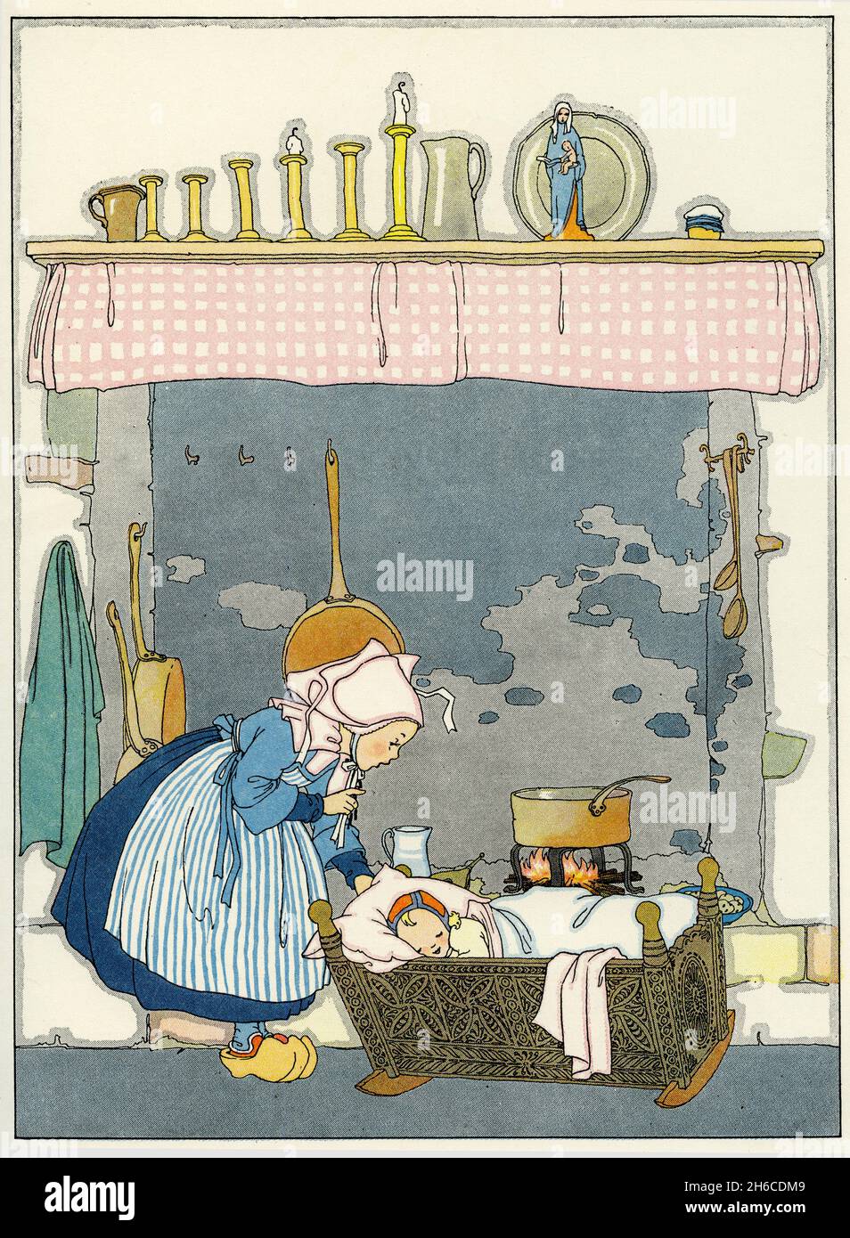 Quaint illustration of tradiitonal life in France, with a mother tending to the baby; published circa 1927 Stock Photo