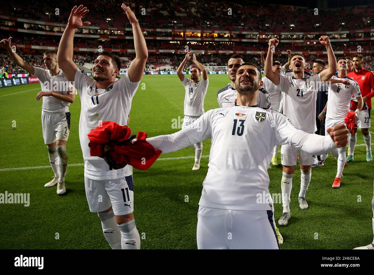 Lisbon, Portugal. 14th Nov, 2021. Serbia's team players celebrate the victory at the end the FIFA World Cup Qatar 2022 qualification group A football match between Portugal and Serbia at the Luz stadium. Mitrovic scored in the 90th minute to send Serbia to the World Cup next year. (Credit Image: © Pedro Fiuza/ZUMA Press Wire) Stock Photo