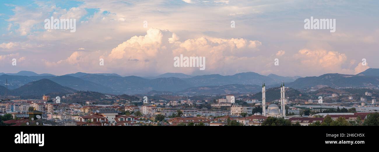 Panorama view over Turkish city with mosque and dramatic sky Stock Photo