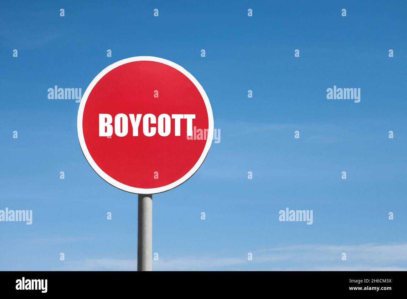 Boycott sign in red round frame on sky background Stock Photo