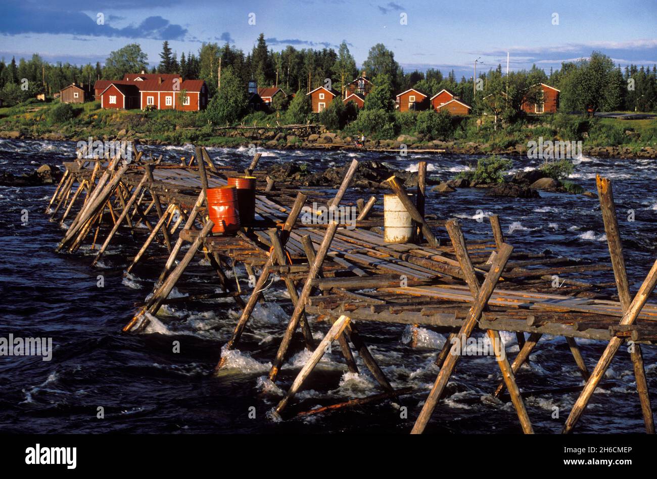 Kukkolaforsen, Sweden in 1989, analog. View of bridge, river and Finland opposite side. Summer. Stock Photo