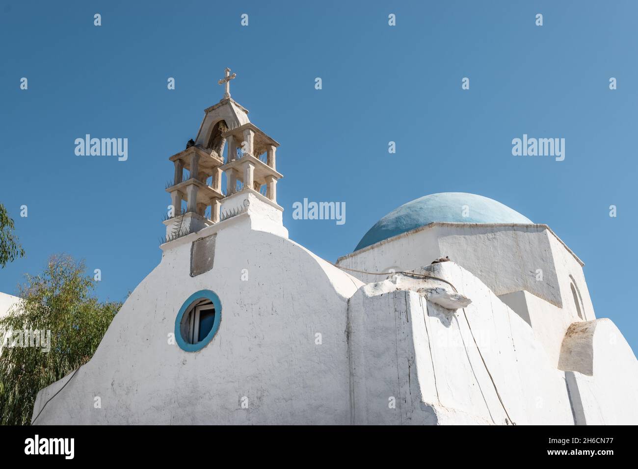 Greek whitewashed church with blue dome. Stock Photo