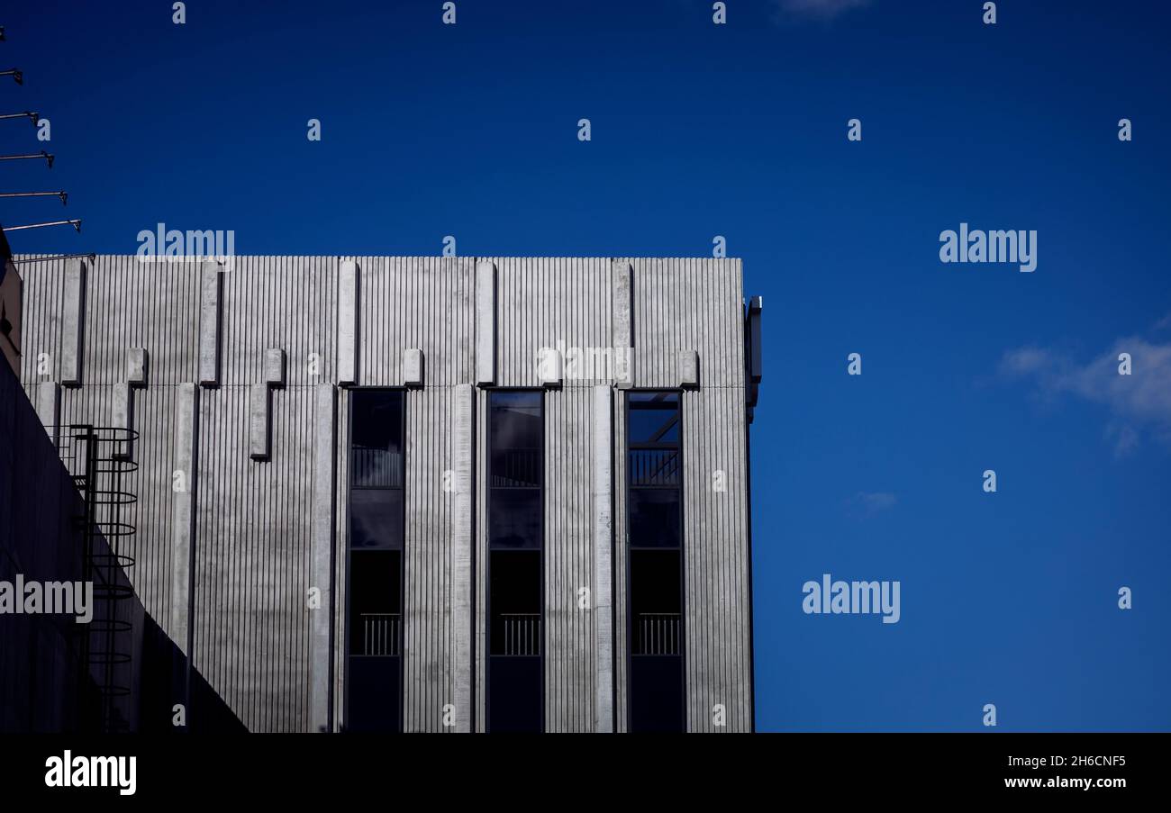 minimalistic architecture. concrete building over sky background Stock