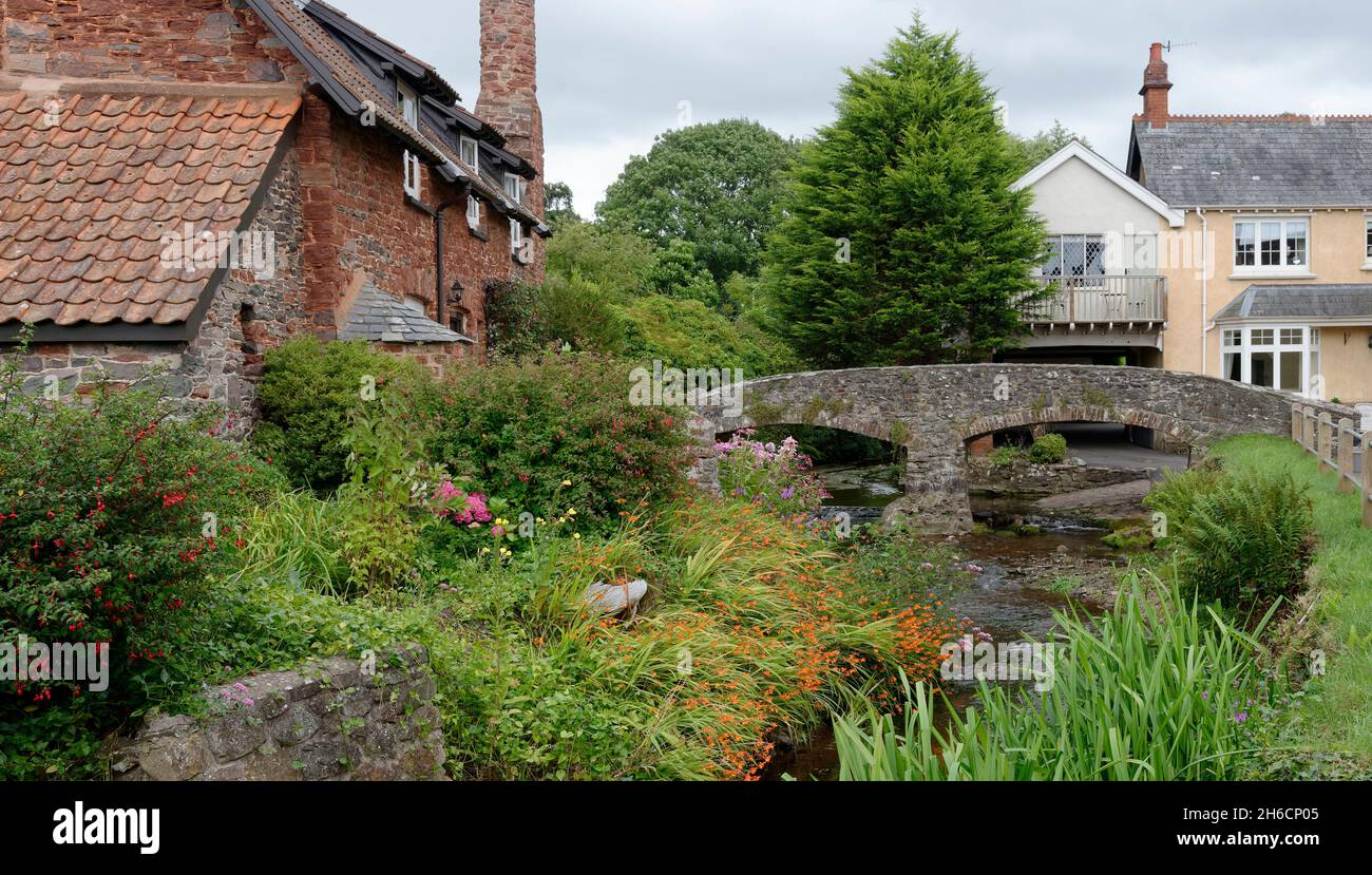 River Aller with Packhorse Bridge and Packhorse Cottage, Allerford, Exmoor, Somerset, UK Stock Photo