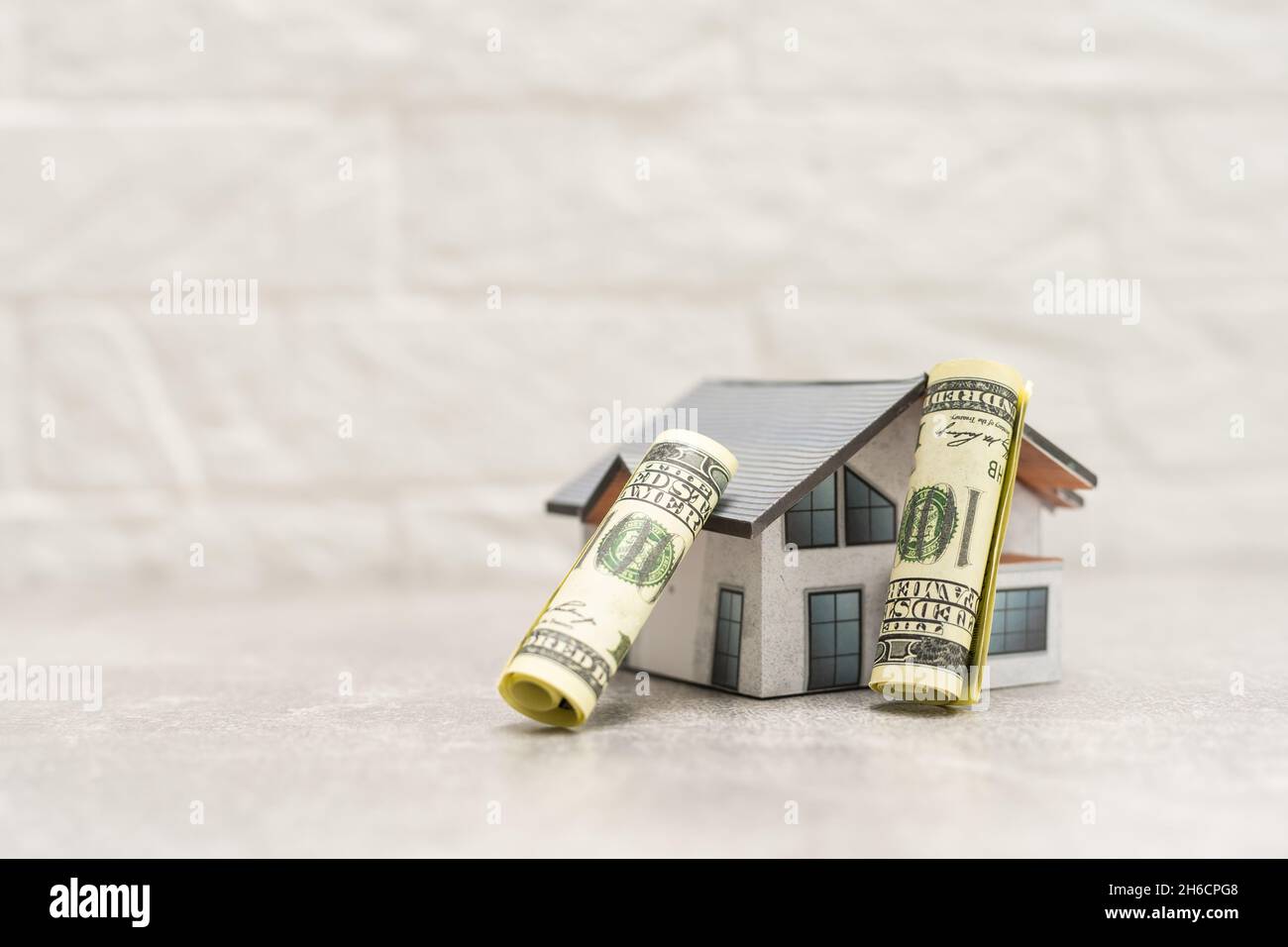 A close up of money and Mock up home, money accumulation, investment, banking or business services, wealth concept, Stock Photo