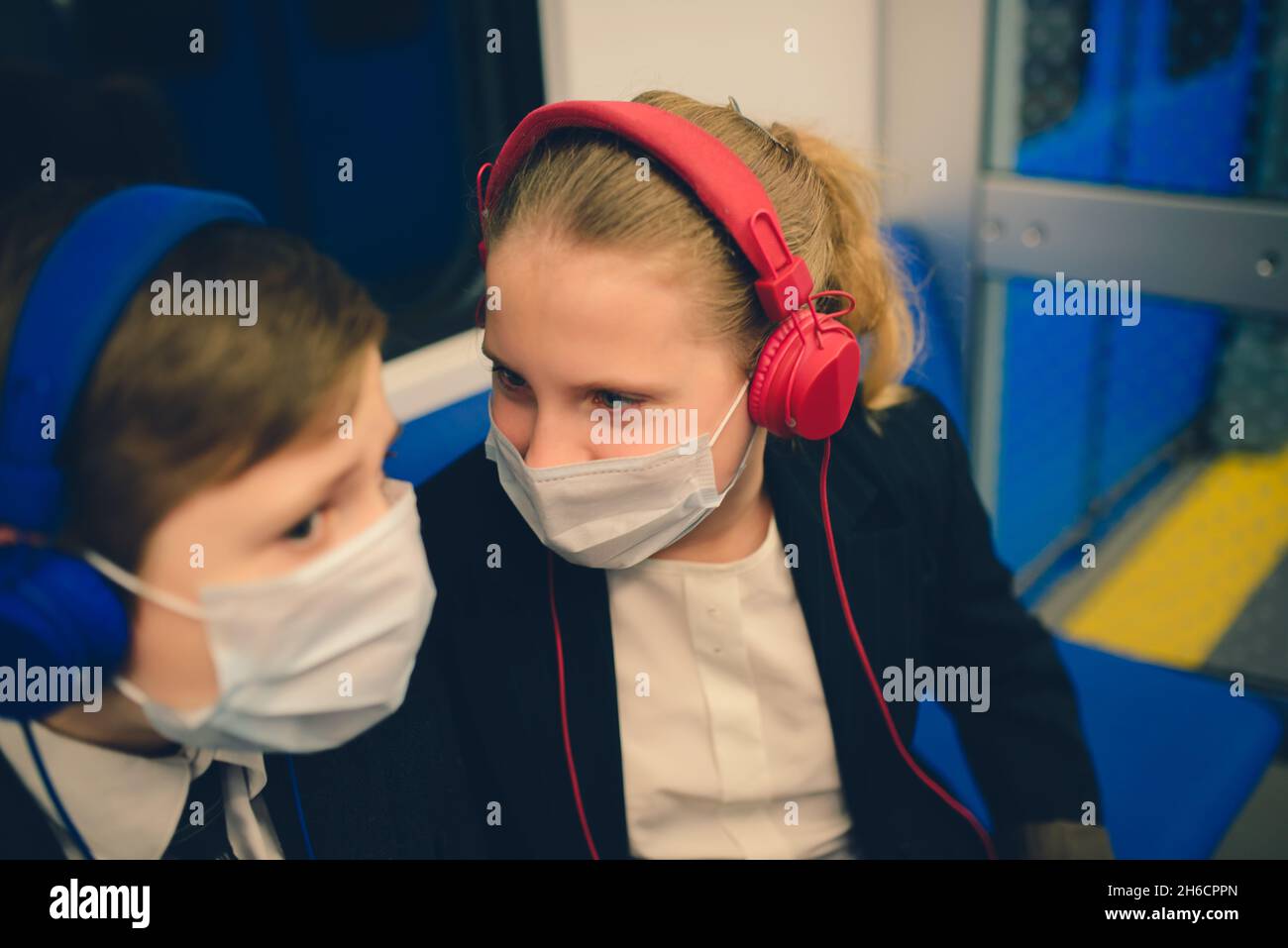 Children with a face mask going back to school after covid-19 ...