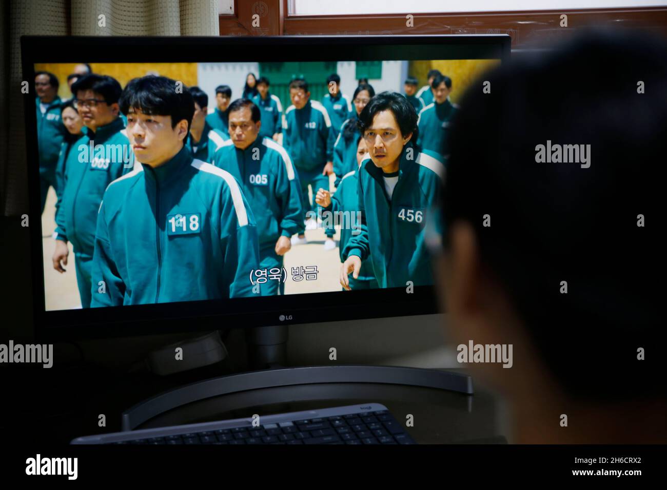 Seoul, South Korea. 15th Nov, 2021. A person watches the South Korean drama  "Squid Game" at home in Seoul, South Korea, Nov. 15, 2021. The South Korean  drama "Squid Game" has drawn