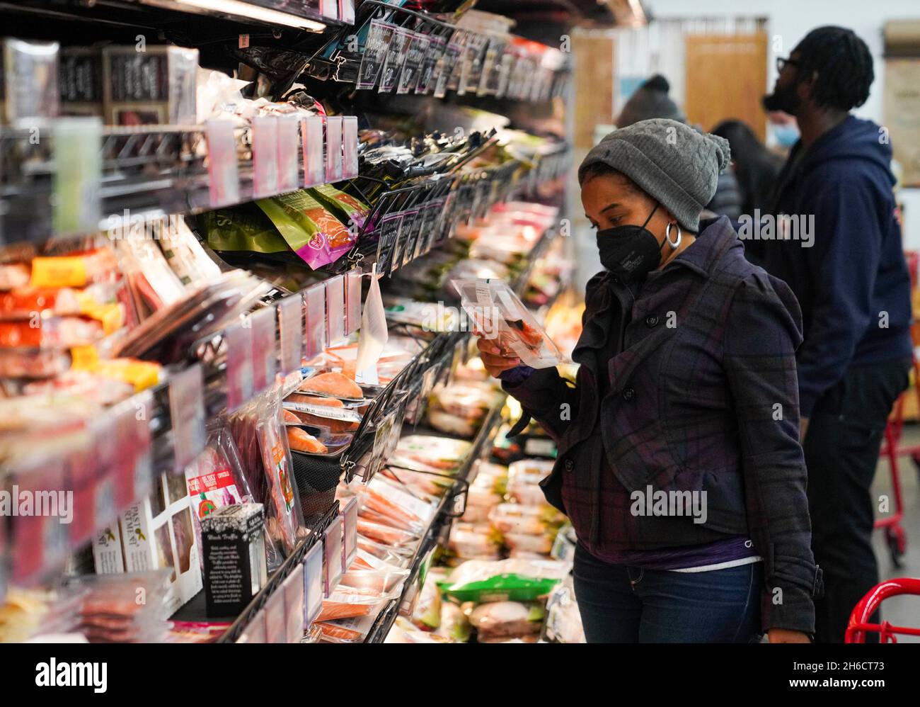 New York, USA. 14th Nov, 2021. People select fish products at a
