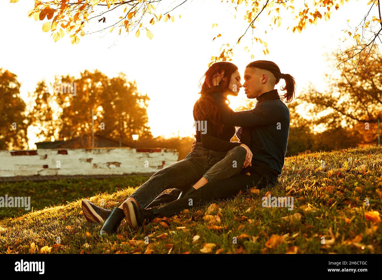 happy young couple kissing outdoor in the autumn park Stock Photo - Alamy
