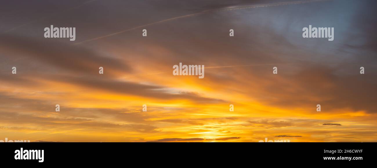 Fiery sunset, colorful clouds in the sky Stock Photo