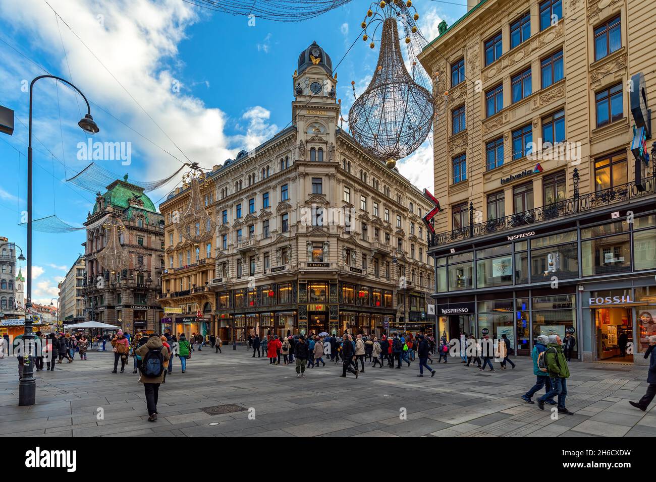 People walking along shops and stores on Graben - one of the most famous promenades and shopping streets in Vienna, Austria. Stock Photo
