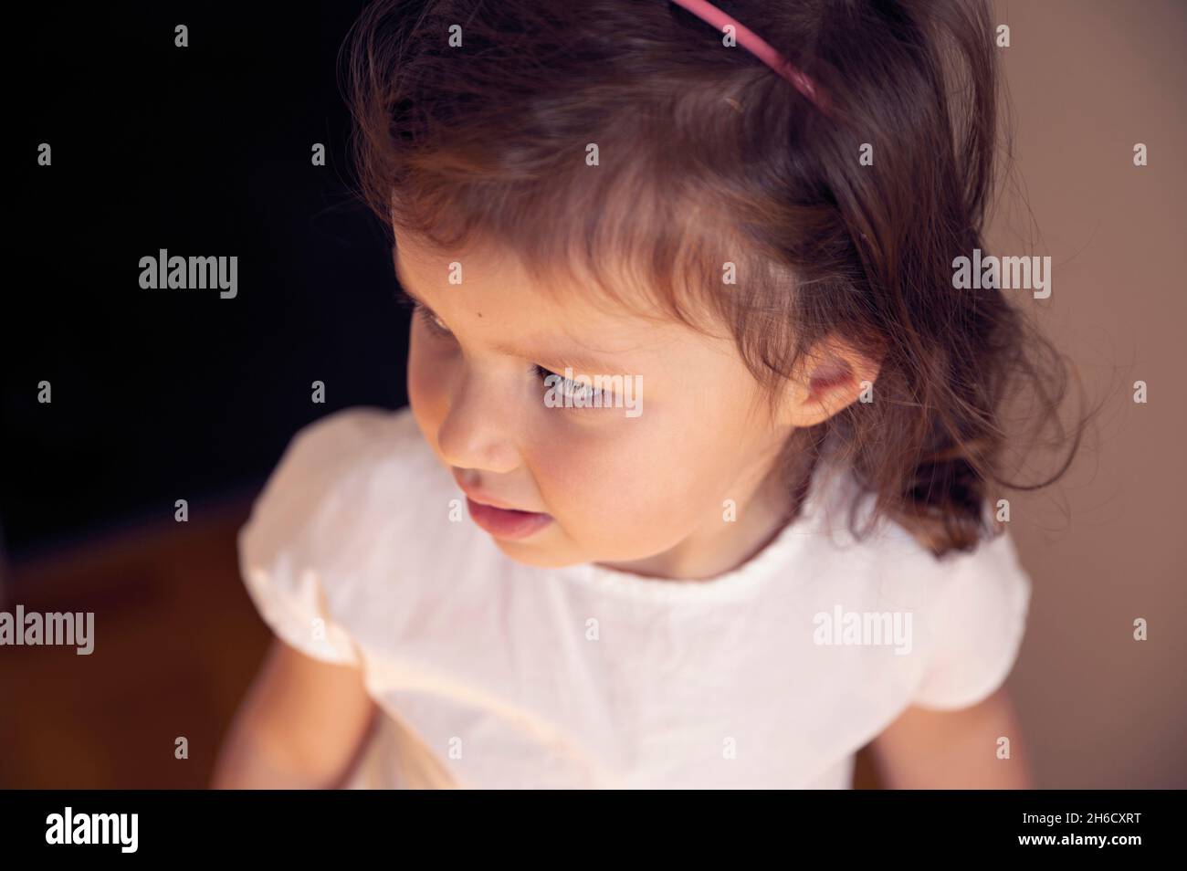 Close-up portrait of a cute little girl - preschooler in a kindergarten Stock Photo